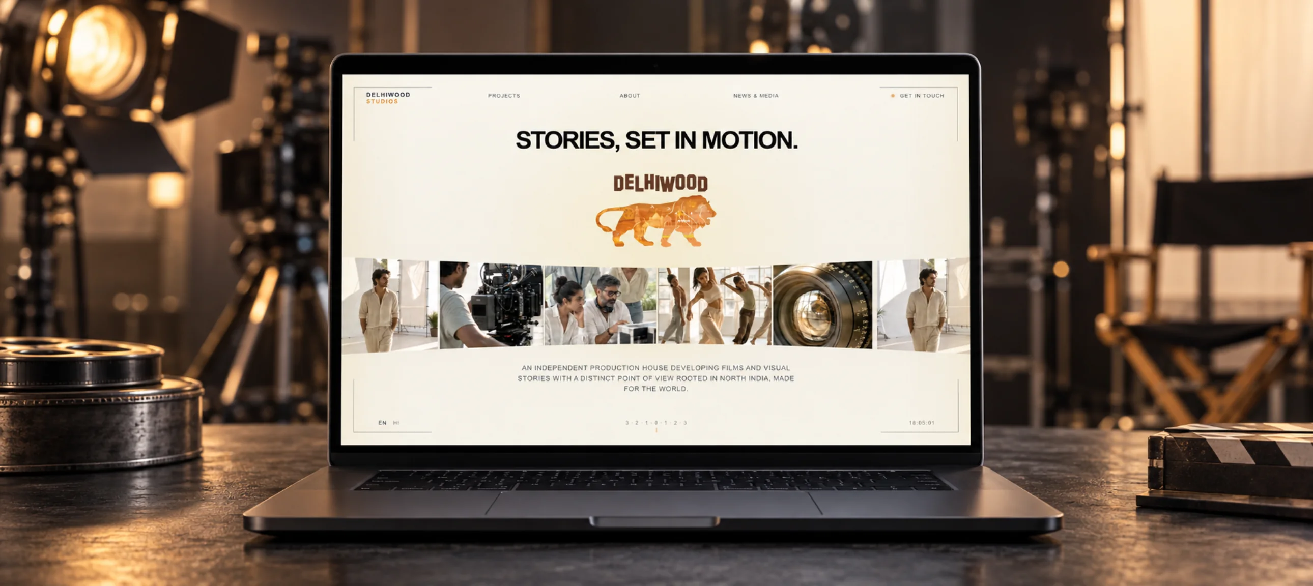 Delhiwood Studios website displayed on a laptop in a film studio setting