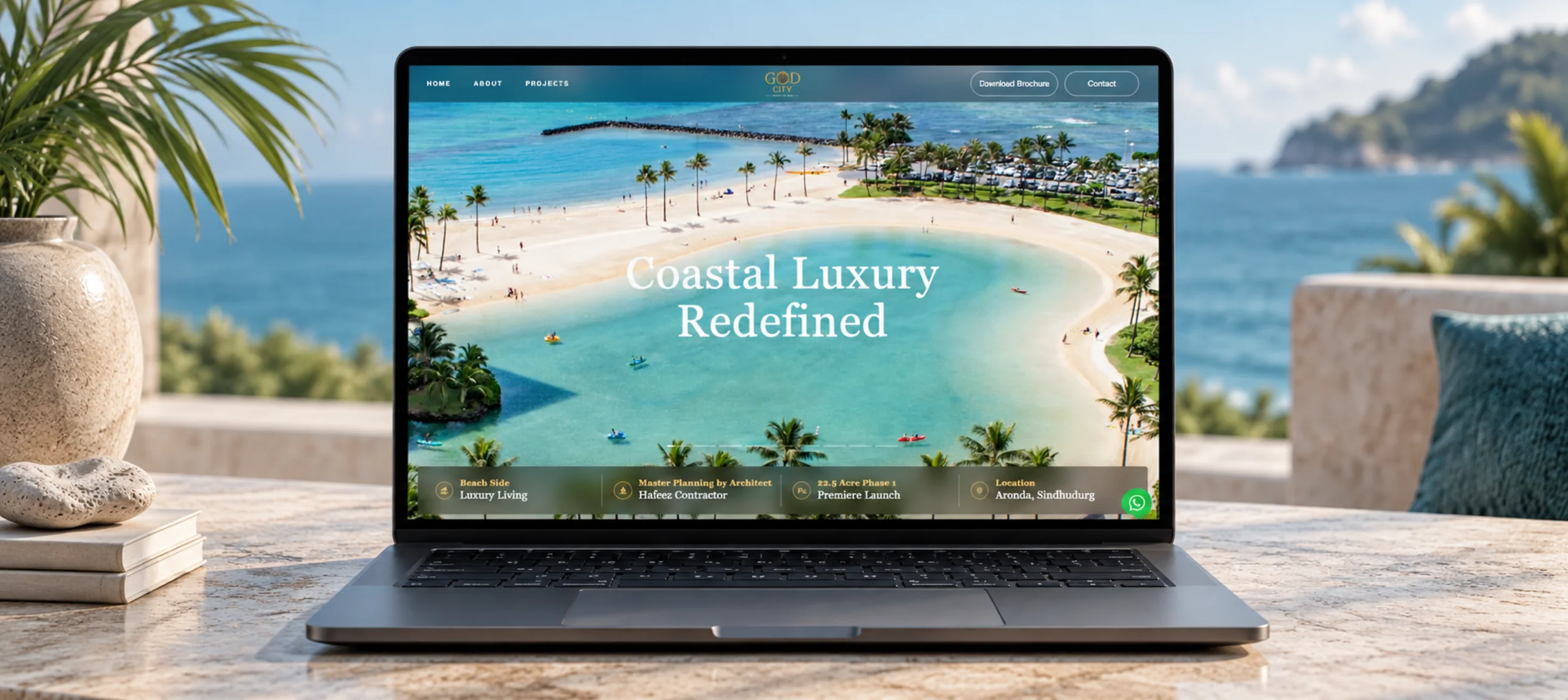 God City Goa website displayed on a laptop in a coastal setting